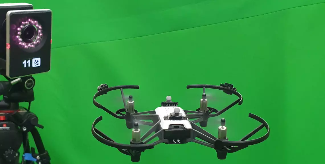 MoCap camera and Drone with reflective markers in front of green screen